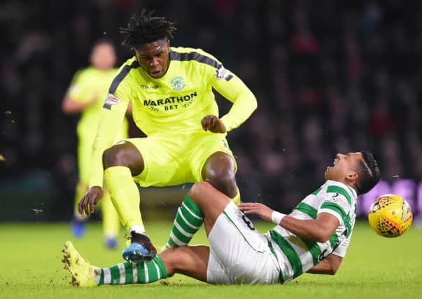 Hibs' Darnell Johnson was banned by the compliance officer for two matches after this tackle on Celtic's Emilio Izaguirre was reviewed. Pic: SNS