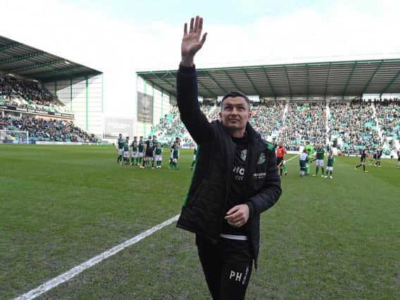 New Hibs boss Paul Heckingbottom salutes the home fans before his first game at Easter Road