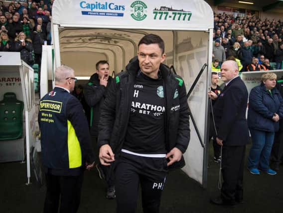 Paul Heckingbottom takes his place in the dugout for his first match as Hibs head coach