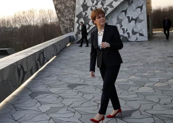 Scotland's First Minister Nicola Sturgeon walks on the terrace as she visits the Philharmonie de Paris, in Paris, on Monday. Pic: AP Photo/Christophe Ena