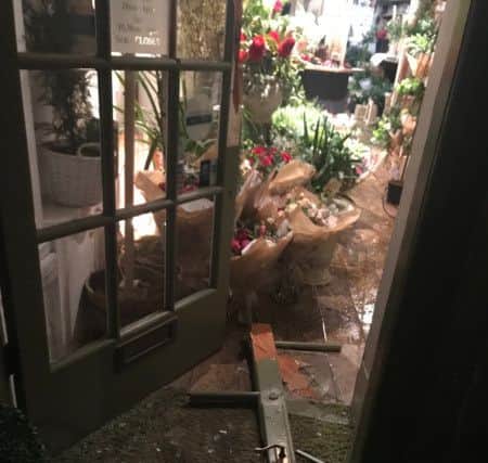 The damage to the door of Rogue florists, William Street, following the robbery on the night of Valentine's Day 2019