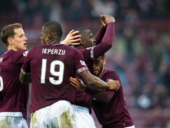 Hearts players celebrate Clevid Dikamona's first goal for the club.