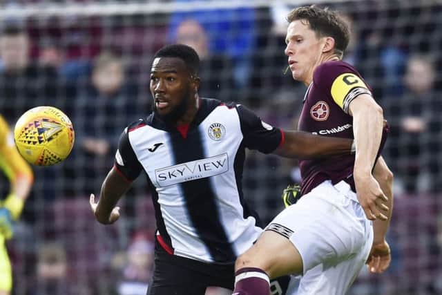 Duckens Nazon  competes with Hearts' captain, Christophe Berra on Saturday