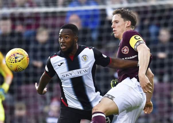 Duckens Nazon  competes with Hearts' captain, Christophe Berra on Saturday