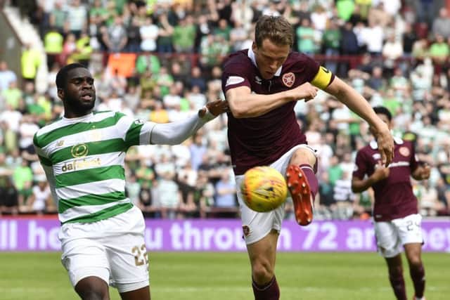 Christophe Berra clears the ball under pressure from Odsonne Edouard during a previous clash between the two sides. Picture: SNS Group