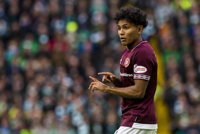 Demetri Mitchell in action for Hearts against Celtic. The on-loan Manchester United youngster's season is over after he sustained a knee injury. Picture: SNS Group