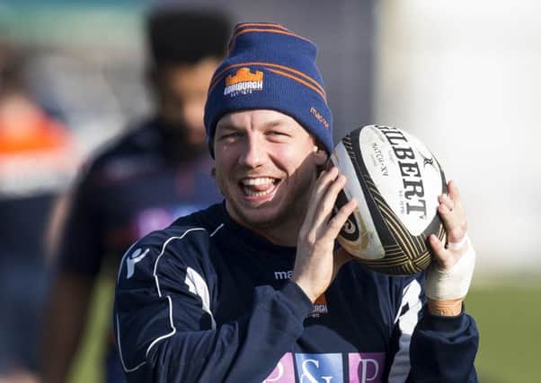 Hamish Watson was in good mood in training, but his left hand is still bandaged. Pic: SNS