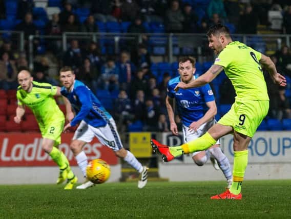 Marc McNulty draws Hibs level from the penalty spot. Pic: SNS