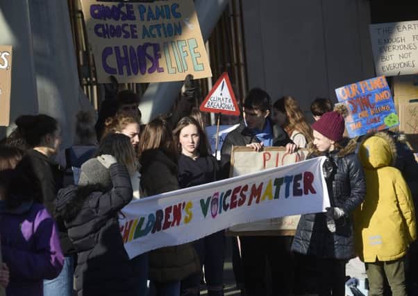 School pupils stage a protest outside the Scottish Parliament calling for action on climate change. Picture: Greg Macvean