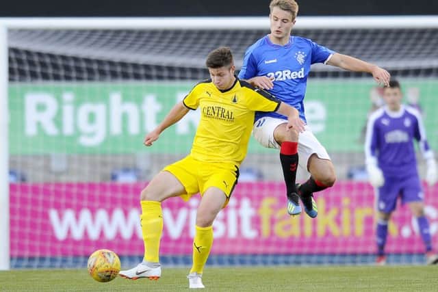 Bartlomiej Gajda (left) takes part in the David Hagen Benefit Game at Falkirk Stadium between a Falkirk/Hearts XI and a Rangers XI. Picture: Michael Gillen