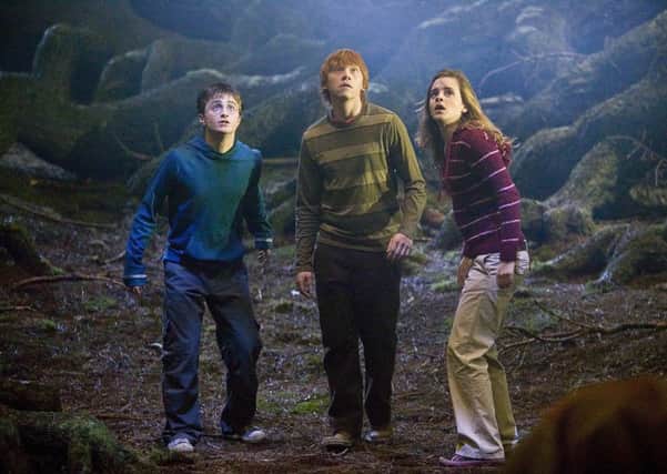 Daniel Radcliffe, left, Rupert Grint, center, and Emma Watson in Harry Potter and the Order of the Phoenix