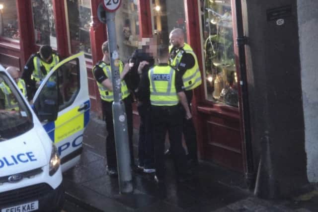 The arrest happened after a suspected stabbing in the Canongate area.