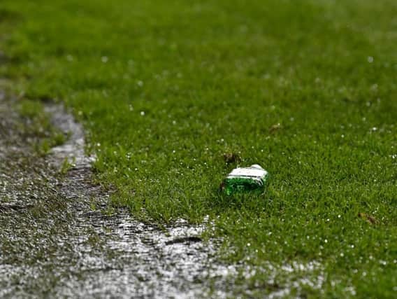 A bottle of Buckfast lies on the turf at Easter Road after being thrown from the stands. Pic: SNS