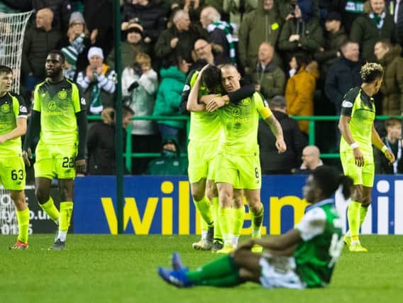 Stephane Omeonga looks on as Celtic celebrate their second goal. Pic: SNS