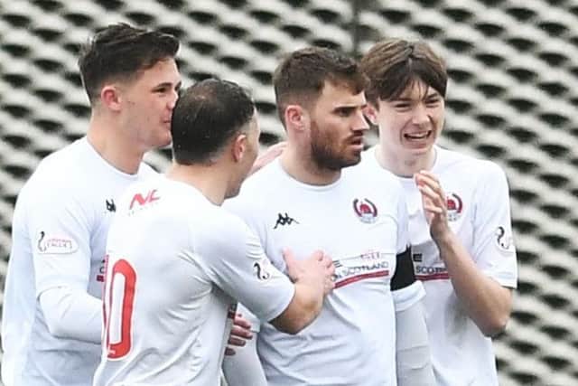 Clyde captain, David Goodwillie, is congratulated after scoring