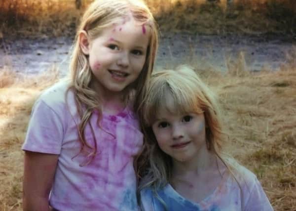 This photo provided by the Humboldt County Sheriff's Office shows Leia Carrico, 8, left, and her sister Caroline Carrico, 5, as they seeked the public's help in locating them. (Humboldt County Sheriff's Office via AP)