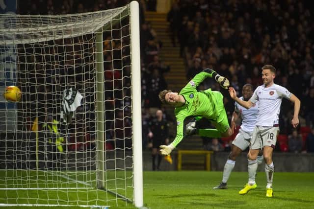 Conor Hazard's dive is in vain as the header from Christophe Berra (not pictured) loops into the net. Picture: SNS Group