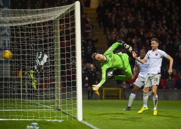 Conor Hazard's dive is in vain as the header from Christophe Berra (not pictured) loops into the net. Picture: SNS Group