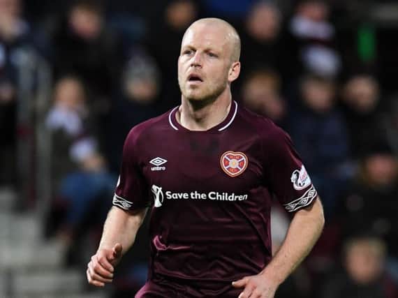 Hearts striker Steven Naismith is to visit a knee specialist