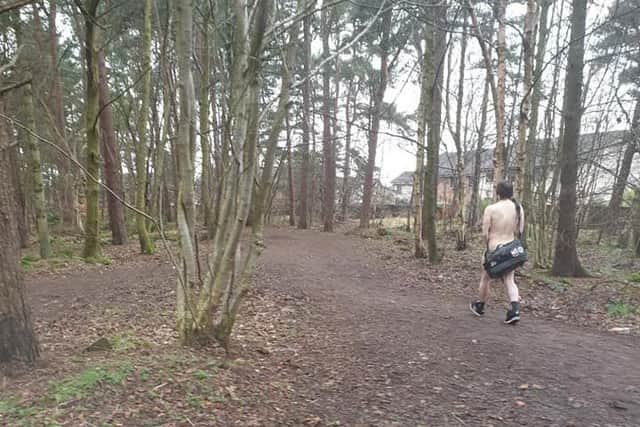 The man was snapped walking in a patch of woodland in Livingston. Picture: contributed