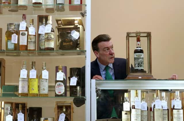 Bonhams whisky expert Martin Green with a bottle of the very rare Macallan-60 year old-1926, that has a label designed by the eminent, internationally acclaimed, British pop artist Sir Peter Blake, which is valued at £500000-£700000 as part of Bonhams Whisky sale on Wednesday March 6.