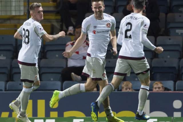 Steven MacLean celebrates putting Hearts 3-0 up at Dens Park in October - a result that put the Tynecastle side six points clear at the top of the Premiership
