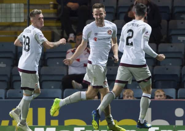 Steven MacLean celebrates putting Hearts 3-0 up at Dens Park in October - a result that put the Tynecastle side six points clear at the top of the Premiership