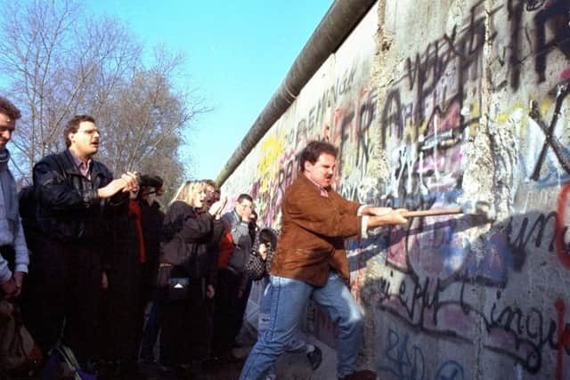 The Berlin Wall fell as the internet was starting to open up the world (Picture: John Gaps III/AP)