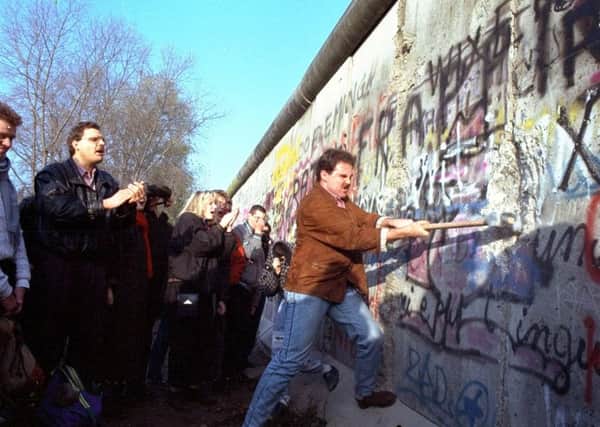 The Berlin Wall fell as the internet was starting to open up the world (Picture: John Gaps III/AP)