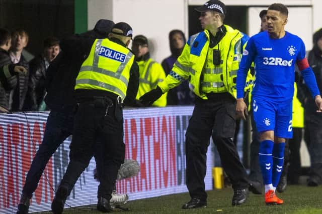 Rangers captain James Tavernier was confronted by a Hibs fan just before half-time