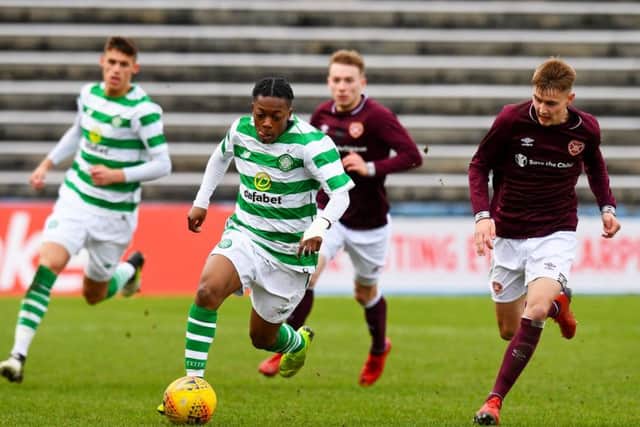 Hearts midfielder Harry Cochrane competes with Celtic's Karamoko Dembele