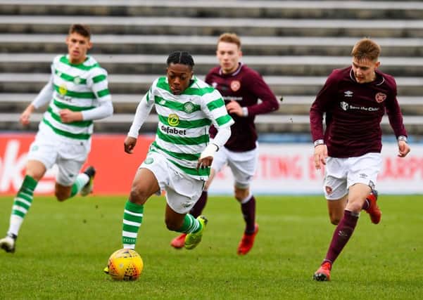 Hearts midfielder Harry Cochrane competes with Celtic's Karamoko Dembele