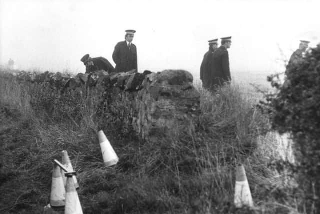 Police search the site near Haddington where the semi-naked body of Helen Scott was discovered.