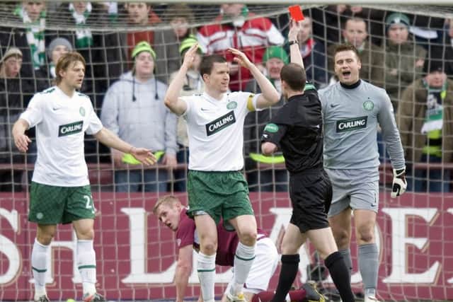 Celtic's Gary Caldwell is shown the red card by referee Willie Collum after foul on Hearts ace Jamie Mole. Picture: SNS/Craig Williamson
