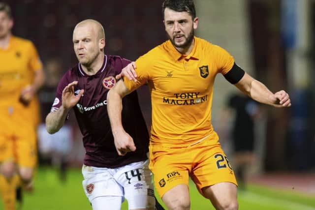 Craig Halkett in action for Livingston against Hearts' Steven Naismith. Picture: SNS Group