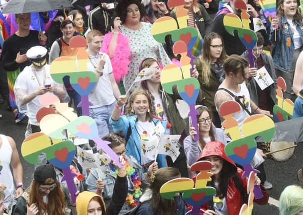 Last years Pride march in Edinburgh attracted crowds, but some LGBTQ+ young people are still facing stigma and rejection. Picture: Greg Macvean