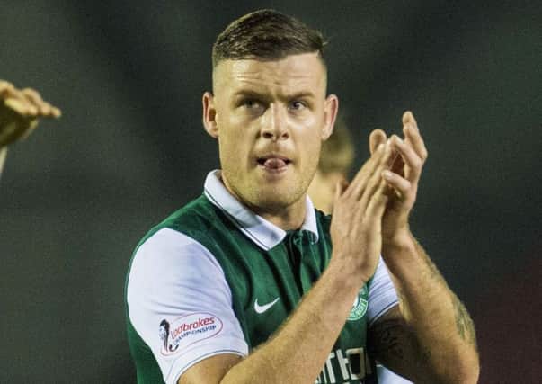 Hibs striker Anthony Stokes salutes the fans at full-time