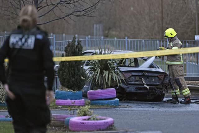 Fire and police were called to the scene on Harperrig Way where the Audi was found ablaze. Picture: Neil Hanna/TSPL