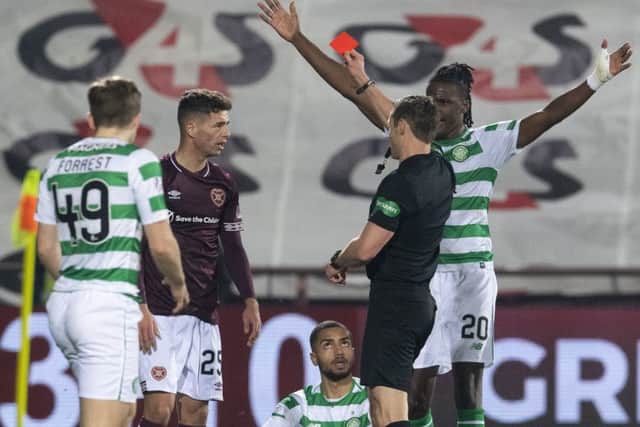 Jamie Brandon is shown the red card after his challenge on Celtics Jeremy Toljan