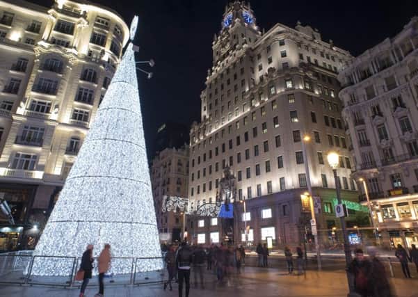 A Christmas tree illumniates the Gran Via in Madrid. Picture: AFP/Getty