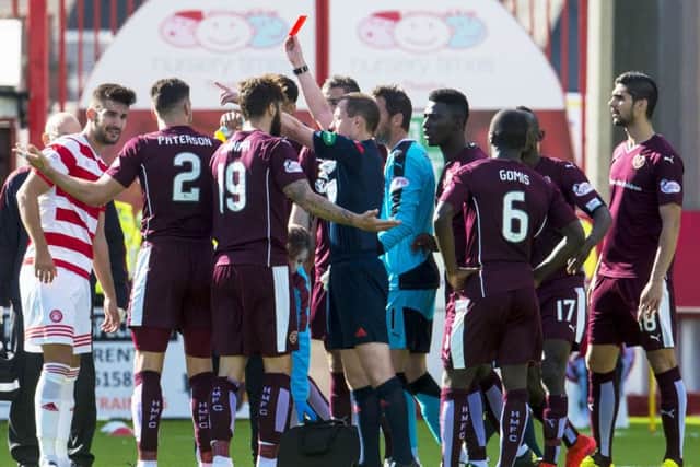 Hearts' Callum Paterson receives a red card from Willie Collum the last time the team lost at Hamilton. Picture: SNS/Sammy Turner
