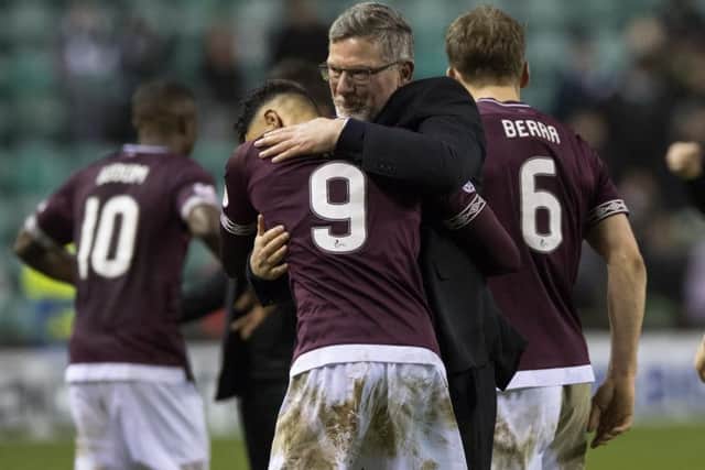 Sean Clare is hugged by Hearts manager Craig Levein. The midfielder has flourished under the Jambos boss in recent weeks. Pic: SNS