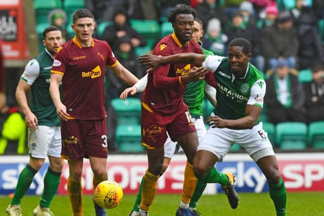 Hibs' Marvin Bartley competes with Gboly Ariyibi during the 2-0 win over Motherwell. Pic: SNS