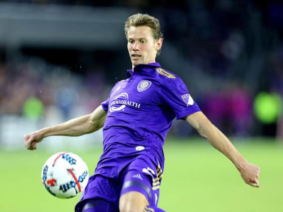 Jonathan Spector plays the ball during an MLS clash between Orlando City SC and New York City FC at the Orlando City Stadium in March 2017