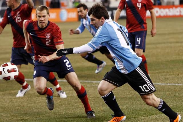 Jonathan Spector keeps a close eye on Lionel Messi during a friendly match between the USA and Argentina in New Jersey, March 2011