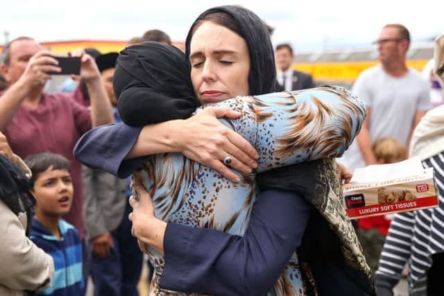 Prime Minister Jacinda Ardern hugs a worshipper at the Kilbirnie Mosque in Wellington, New Zealand. Picture: Getty