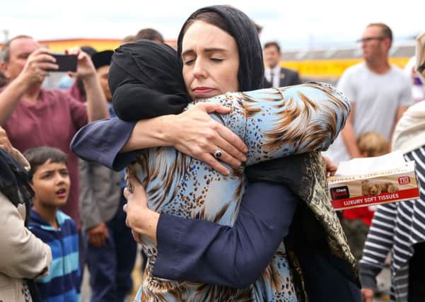Prime Minister Jacinda Ardern hugs a worshipper at the Kilbirnie Mosque in Wellington, New Zealand. Picture: Getty