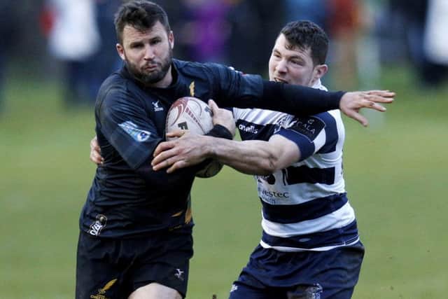 Heriots' Ross Jones tackles Currie's Joe Reynolds. The two teams meet this weekend. Pic: SNS