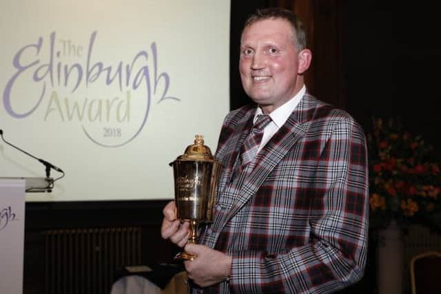 Donning a suit made of the official City of Edinburgh tartan, which he had made especially for the occasion, rugby legend and charity campaigner Doddie Weir receives the City of Edinburgh Award in November. Pic: City of Edinburgh Council
