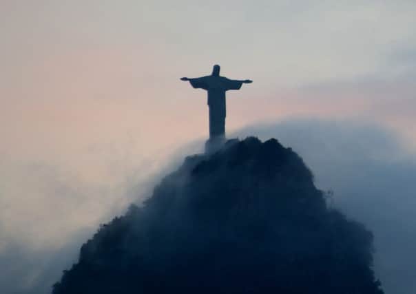 The statue of Christ the Redeemer overlooks Rio de Janeiro in Brazil (Picture: Christophe Simon/AFP/GettyImages)